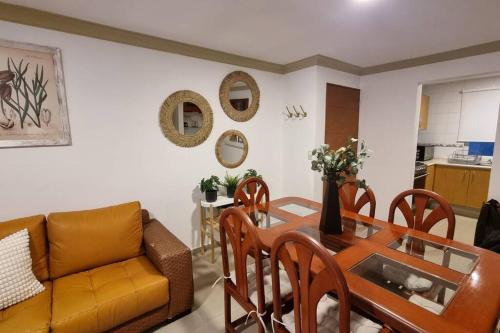 a living room with a table and a couch at 3BR Sn Rafael CDMX metro, mercado, Reforma, Zócalo in Mexico City