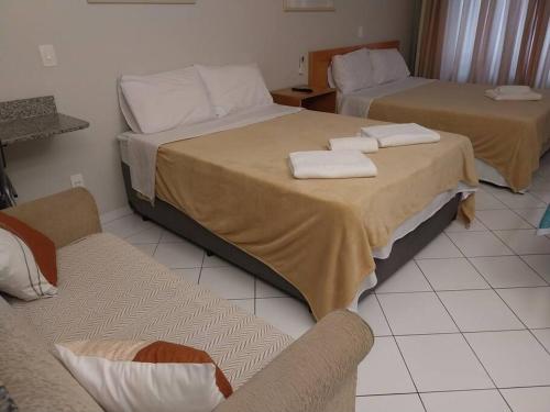 Una cama o camas en una habitación de Flat in Allianz Parque com estacionamento