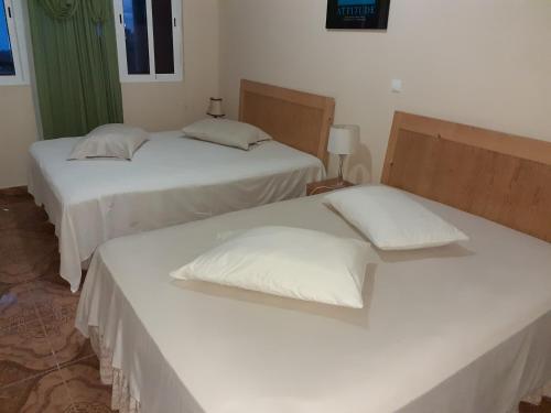 Ліжко або ліжка в номері Residensia Ka Denxu