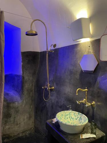 a bathroom with a sink and a shower at Casa Lina in Ostuni