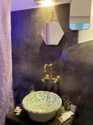 a bathroom with a sink and a faucet at Casa Lina in Ostuni