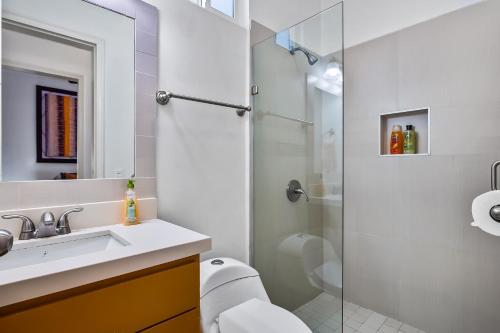 a bathroom with a shower and a sink and a toilet at Villa Olivo 45 - Playa Arcangel in Rosarito