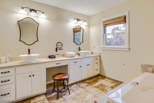 a bathroom with two sinks and a mirror at Large Dahlonega Home, Ideal for Family Gatherings! in Dahlonega