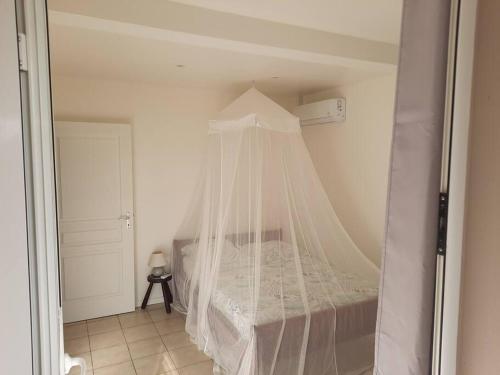 Postel nebo postele na pokoji v ubytování Appartement sable blanc r a i a