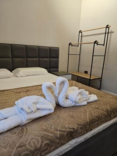 Ένα ή περισσότερα κρεβάτια σε δωμάτιο στο Sky Apartaments city center