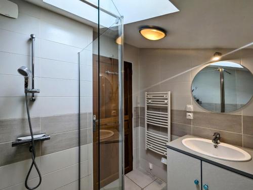 a bathroom with a shower and a sink and a mirror at Maison de charme en Berry - proche Zoo de Beauval et Cité médiévale de Loches - FR-1-591-169 in Arpheuilles