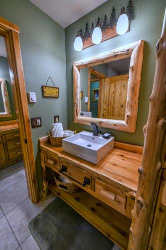 a bathroom with a sink and a mirror at Summit Lake Lodge in Summit Lake