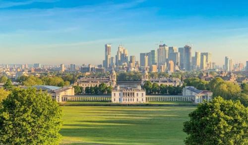 a view of a building with a city in the background at A two bedroom a stride away from Meridian Greenwich in London