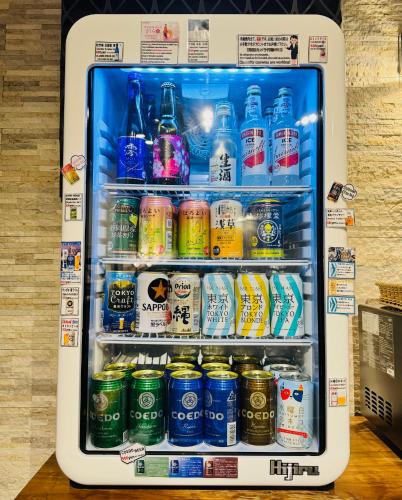 a refrigerator filled with bottles and cans of soda at Act Hotel Roppongi in Tokyo
