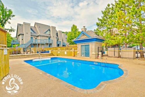 a large swimming pool in front of a house at Blue Mtn 1 Bedroom w Mountain View in Blue Mountains