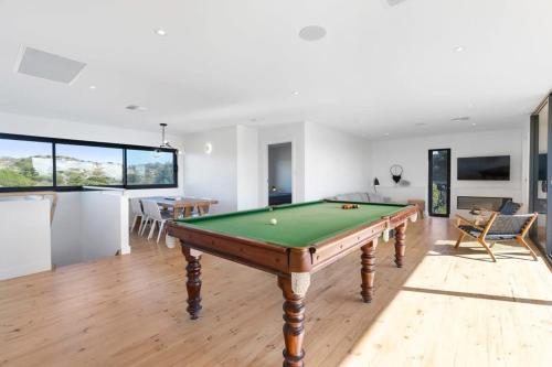 a living room with a pool table in it at 81 Bristow-Smith Ave Goolwa Beach - BYO Linen - WiFi in Goolwa South
