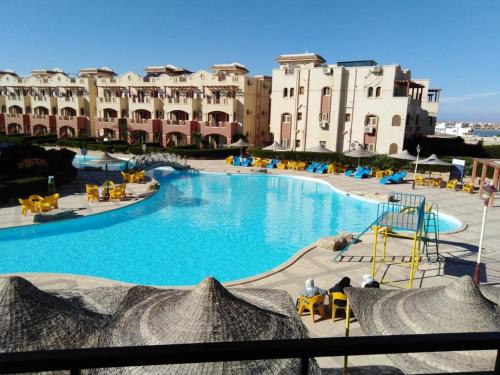 a view of a swimming pool in a resort at Lasirena Resort Aqua Park-Family Only in Ain Sokhna