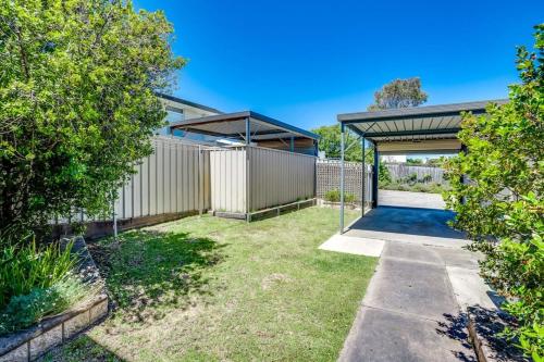 a backyard with a basketball court and a fence at 4 1 Harbour View Terrace BYO Linen in Victor Harbor