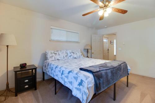 a bedroom with a bed and a ceiling fan at Timber Creek Escape in Sisters