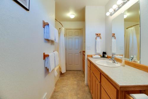 a bathroom with a sink and a mirror at Timber Creek Escape in Sisters