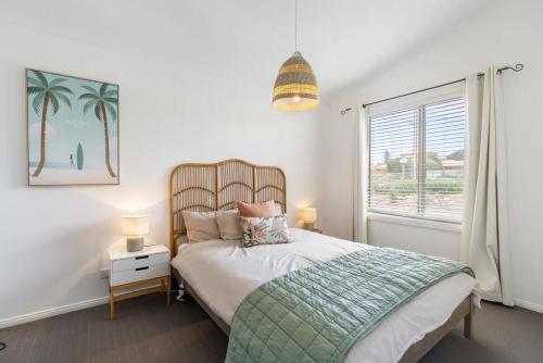a bedroom with a bed and a window at 32 Beach Rd Goolwa South-No Linen Included in Goolwa South