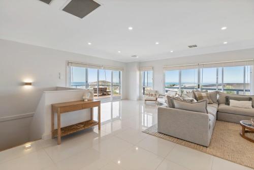 a living room with a couch and a table at 3 Jill Ct Encounter Bay in Encounter Bay