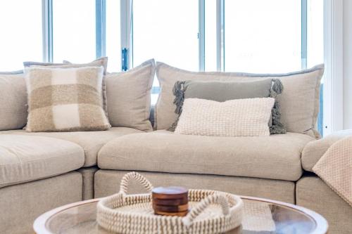 a living room with a couch and a coffee table at 3 Jill Ct Encounter Bay in Encounter Bay