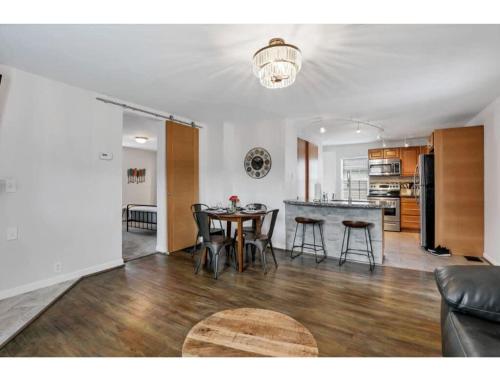 a living room and kitchen with a table and chairs at Housepitality - Little River Trails in Mason