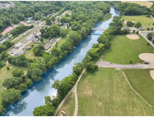 an aerial view of a river with a bridge at Housepitality - Little River Trails in Mason