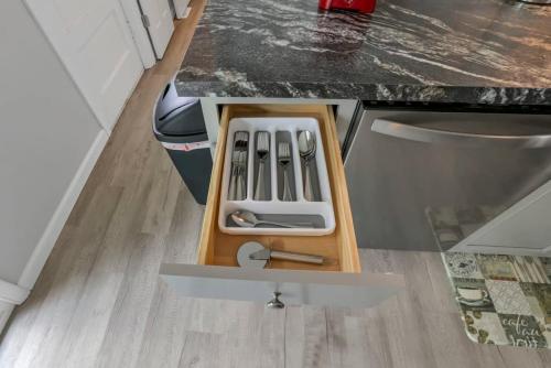 a kitchen counter with a drawer with tools in it at Housepitality - The Gahanna Ranch - 3 BR - Airport in Gahanna