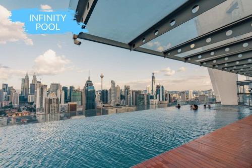 a infinity pool on the top of a building at KLCC View Savannah- In a Tropical State of Mind in Kuala Lumpur