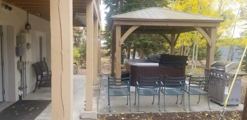 a gazebo with chairs and a grill on a patio at Brighton Ski Resort Hidden Falls 1 Bedroom Chalet Utah in Brighton