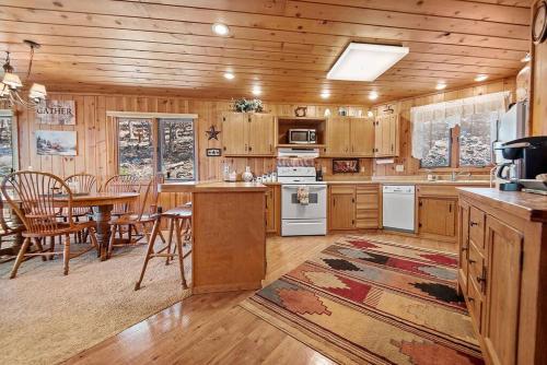 a kitchen with a table and a dining room at Holiday House in Rapid City