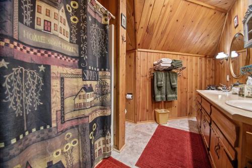a bathroom with a sink and a shower curtain at Holliday House in Rapid City