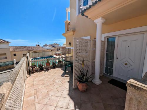 a balcony of a house with a white door at Viña Home in Torre del Mar