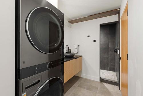 a washer and dryer in a bathroom with a shower at Zion loft basement unit 4 in Springdale