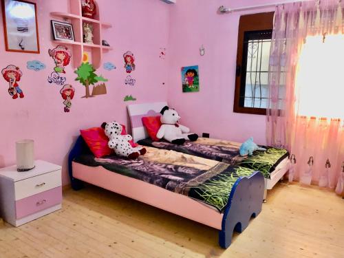 Voodi või voodid majutusasutuse Tirana Family Apartment toas