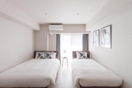 Postel nebo postele na pokoji v ubytování LANG Hotel Kameido-2#Near Akihabara#チェックアウトのみ清掃あり