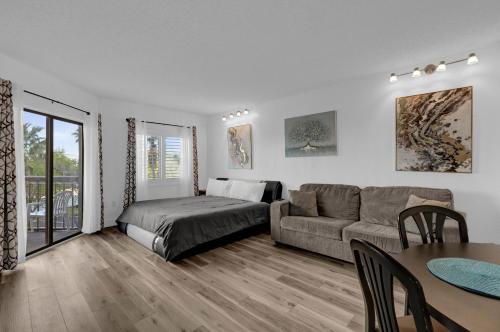 a living room with a couch and a table at Cozy Condo on International Dr. Near Universal Studios in Orlando
