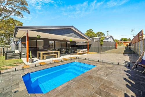 a house with a swimming pool in a yard at Pool Side Point Oasis - Plunge Pool in Sanctuary Point