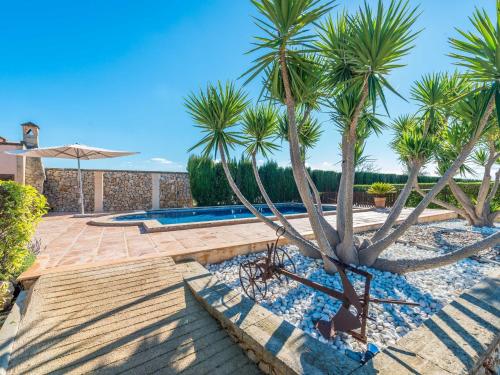 a patio with palm trees and a swimming pool at Buenos Aires - Villa With Private Pool In Manacor Free Wifi in Manacor
