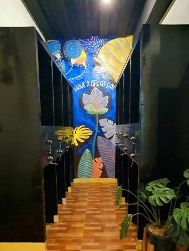 a set of stairs with a sign that says take a great day at TAGBALAYON Lodging House in Siquijor