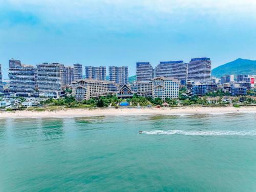 acean view of a city with a beach and buildings at DoubleTree by Hilton Shanwei in Shanwei