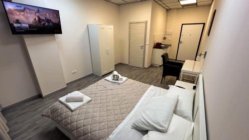 Loft Office 3 tesisinde bir odada yatak veya yataklar