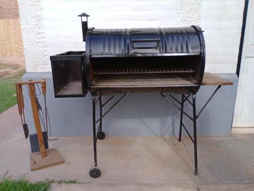 a barbecue grill sitting on top of a table at La Aldea in Rodeo de la Cruz