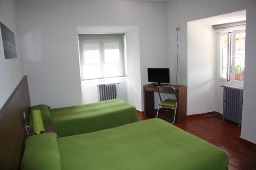 TV a/nebo společenská místnost v ubytování Hostal La Estación