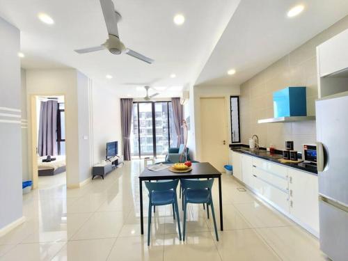 a kitchen with a table and chairs in a room at D'Pristine 1512A walk to Legoland Netflix bySTAY in Nusajaya