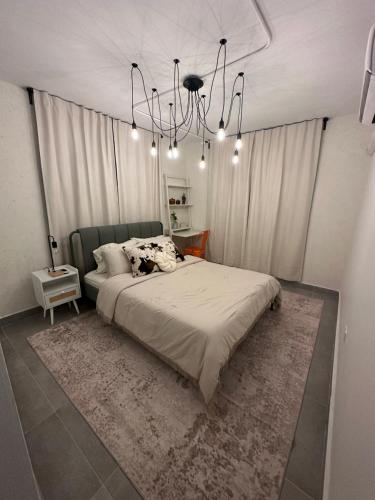 Ein Bett oder Betten in einem Zimmer der Unterkunft Oasis La Merced - Near Plaza Las Americas - San Juan