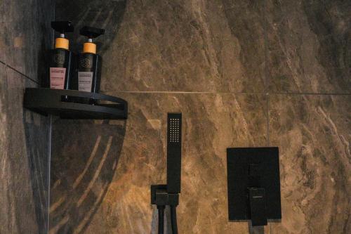 two bottles of wine sitting on a tile floor at Shanming Boutique Homestay in Fenghuang