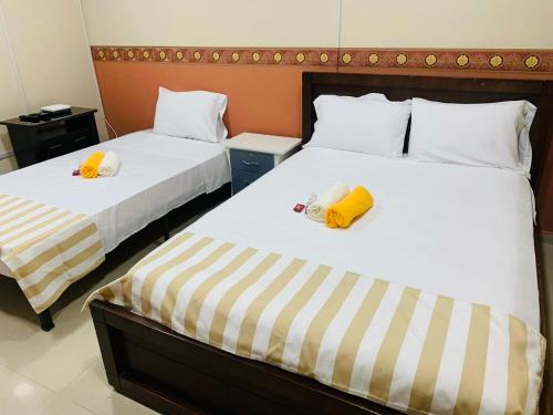 Una cama o camas en una habitación de Casa Mango