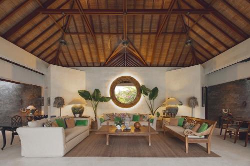 a living room with a couch and a table at Villa Alabali in Seminyak