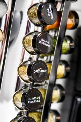 a bunch of bottles of wine in a wine rack at Serene Condo W/ LED Lights In Heart Of Raleigh in Raleigh