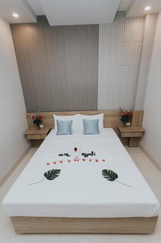 Postel nebo postele na pokoji v ubytování Khoa Hotel Phan Thiết