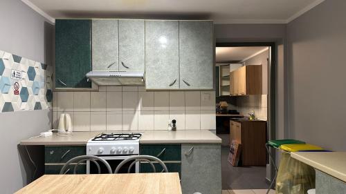 a kitchen with a stove and a counter top at S35 in Białystok