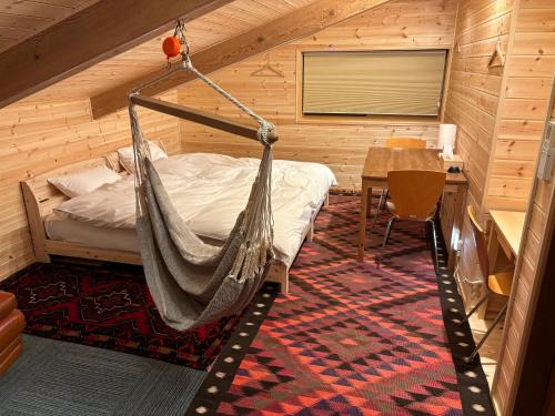 Voodi või voodid majutusasutuse ゲストハウス かぶろの庭 toas